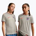 Футболка футбольна дитяча Nike England Pre-Match pewter grey/bright crimson