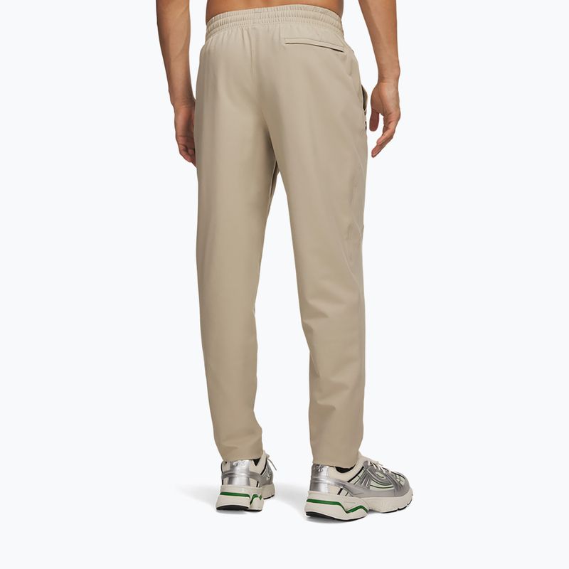 Штани для тренувань чоловічі Under Armour Unstoppable Tapered Pants city khaki/black 3
