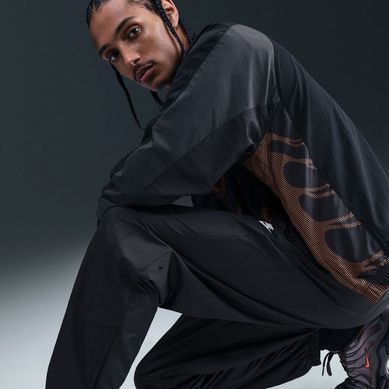 Штани чоловічі Nike Windrunner Lined black/white 9