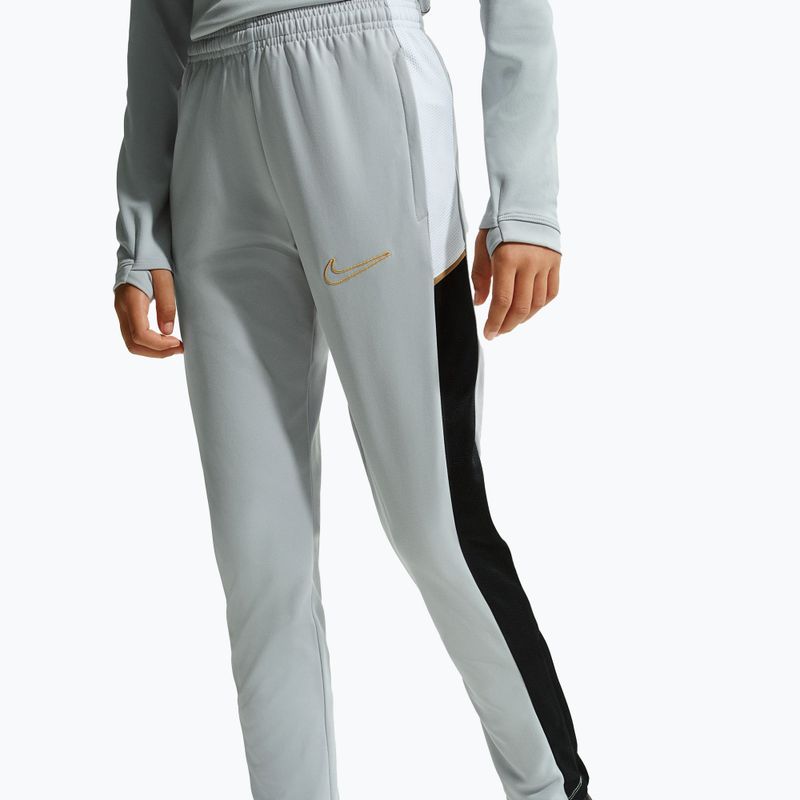 Штани дитячі Nike Academy Dri-Fit Jr light smoke grey/white/black/metallic gold 2