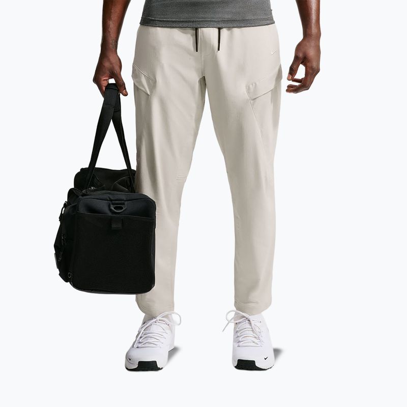 Штани чоловічі Nike Unlimited ight orewood brown/black/light orewood brown 7