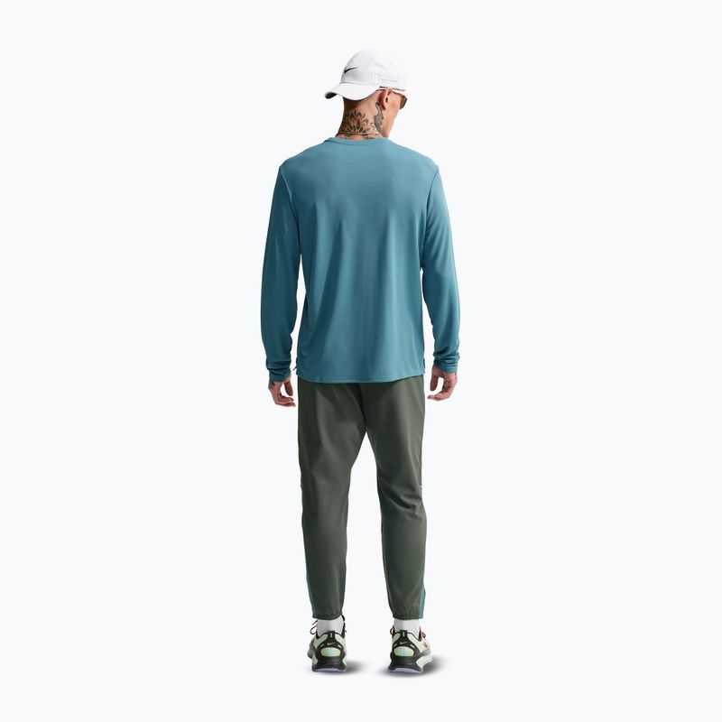 Штани для бігу чоловічі Nike Miler Dri-Fit Woven camo green/mineral slate 3