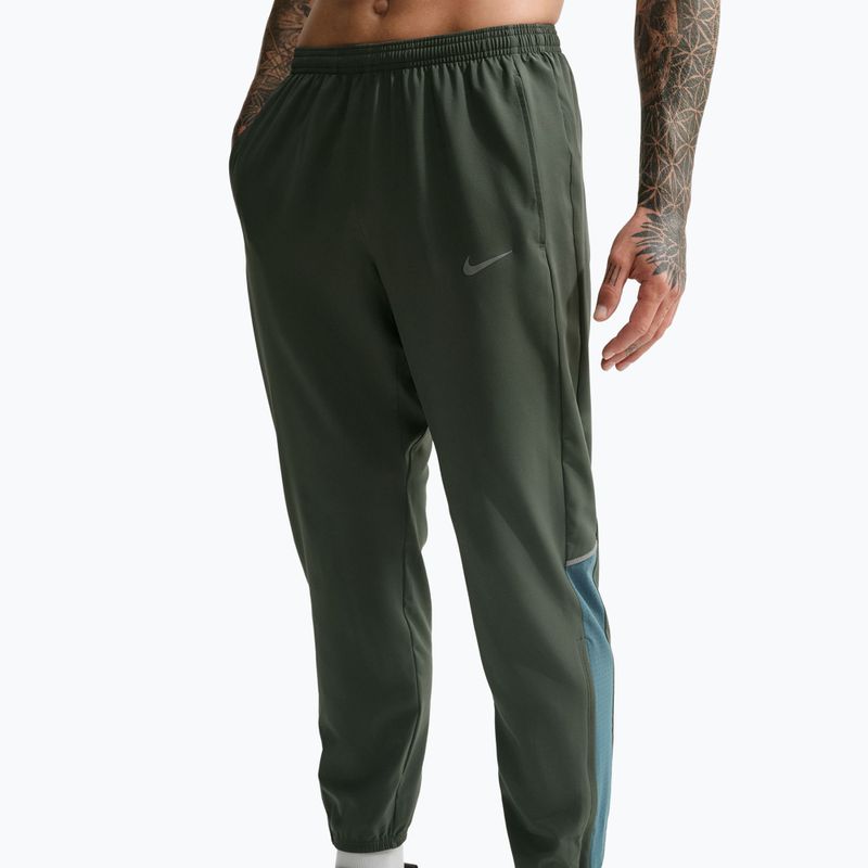 Штани для бігу чоловічі Nike Miler Dri-Fit Woven camo green/mineral slate 4