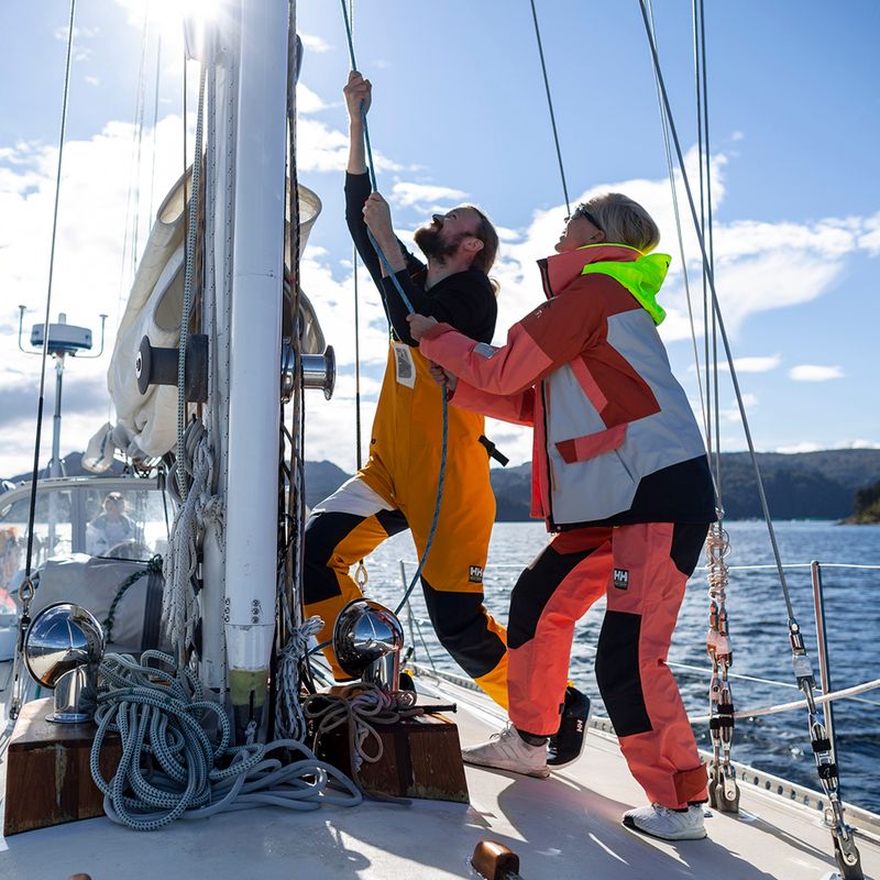 Штани вітрильні жіночі Helly Hansen Newport Coaсталь Bib peach echo 10